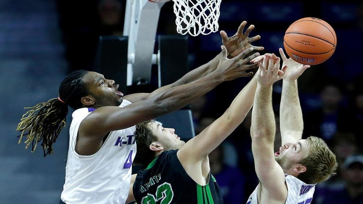 Kansas State’s D.J. Johnson, left, and Austin Budke battle North Dakota’s Conner Avants for a rebound during the first half Tuesday in Manhattan.
