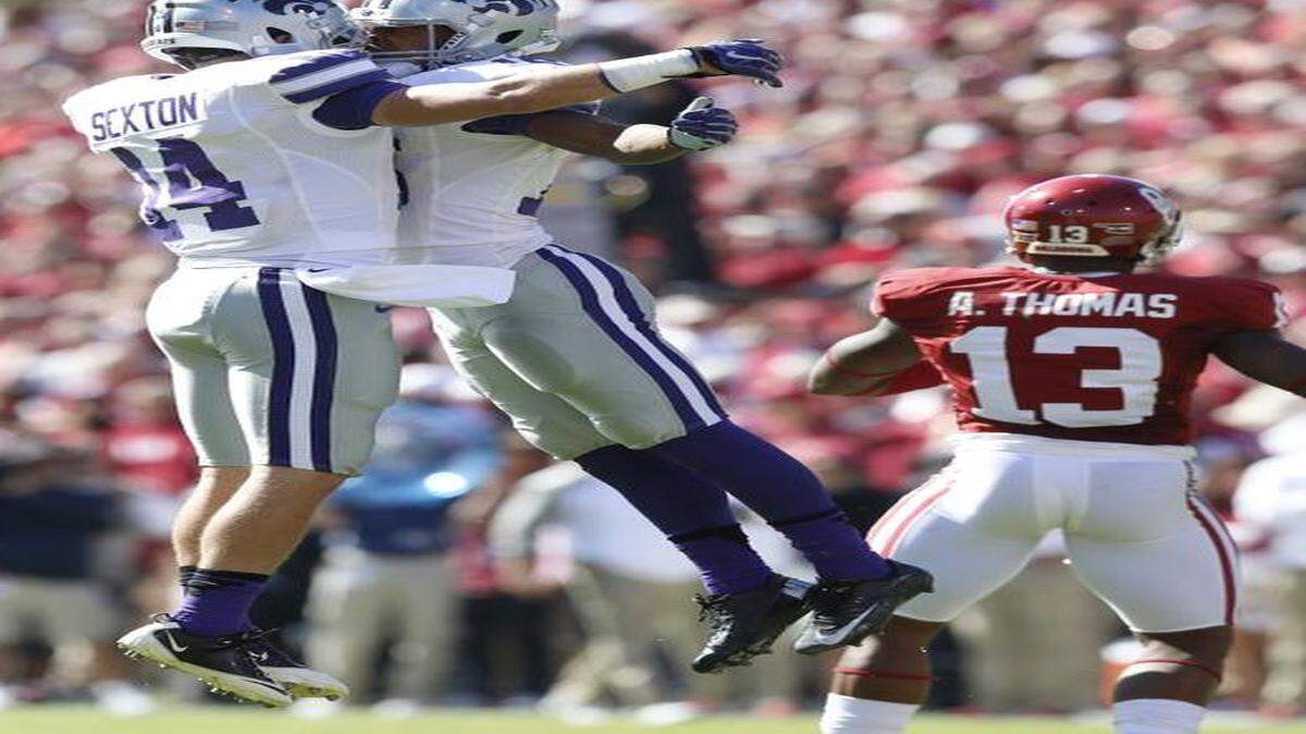 
K-State receivers Curry Sexton, left, and Tyler Lockett celebrate Lockett's big catch in the second half at Oklahoma in October.
