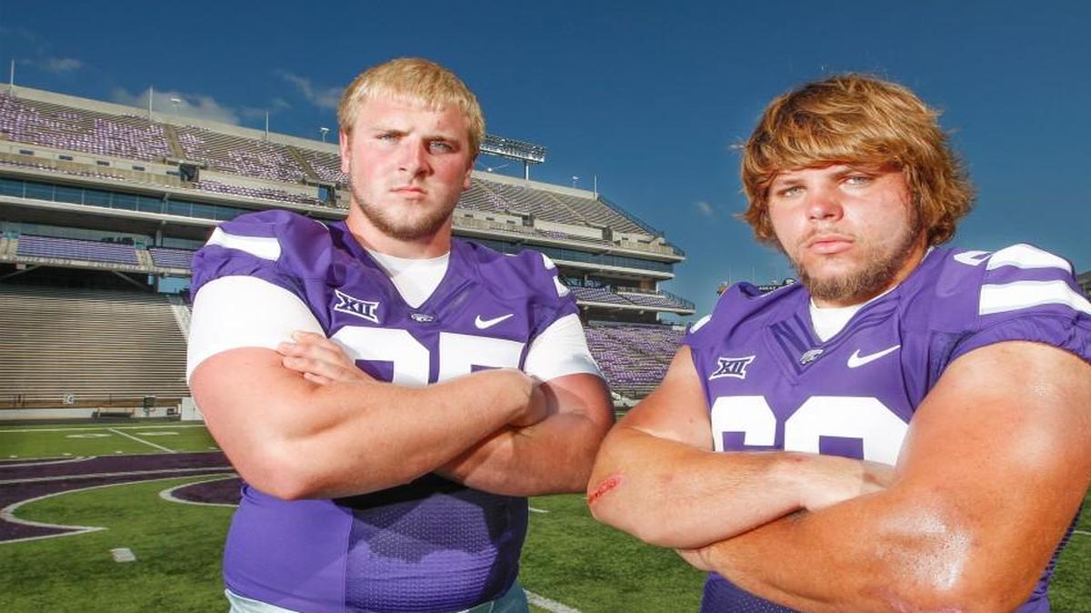 
Travis Britz, left, and Will Geary, who will anchor Kansas State’s defensive line, pose for a picture during media day at Snyder Family Stadium. 
