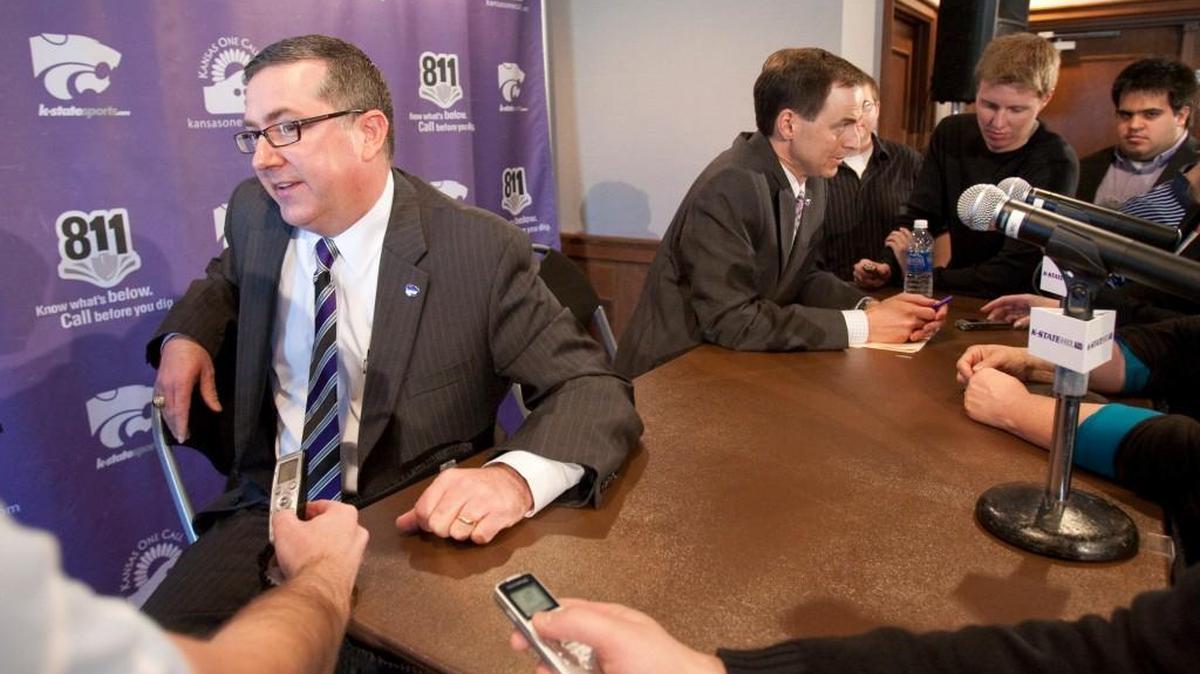Kansas State president Kirk Schulz, left, answers questions at a 2012 news conference. Schulz is leaving K-State to become Washington State University’s president.