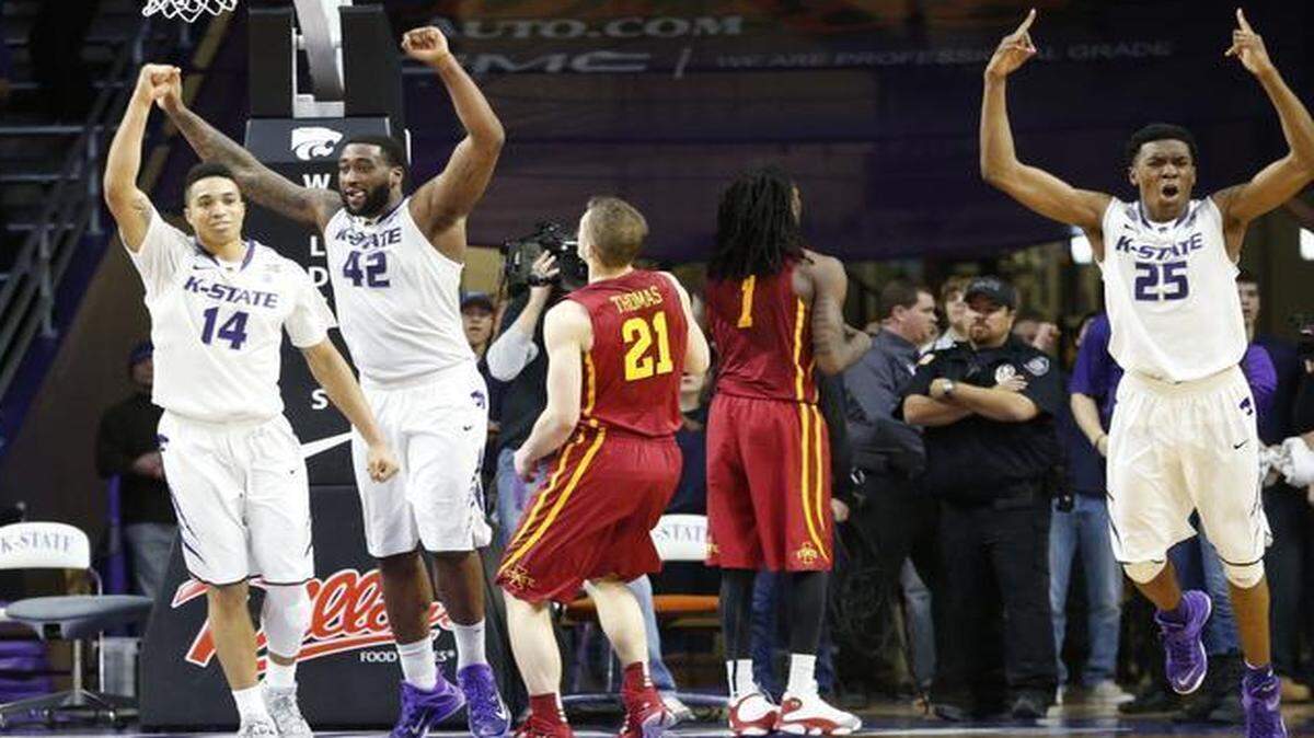 
Kansas State’s Justin Edwards (14), Thomas Gipson (42) and Wesley Iwundu (25) celebrate as Iowa State guard Matt Thomas watches his shot bounce off the rim at the end of Saturday’s game in Manhattan.

