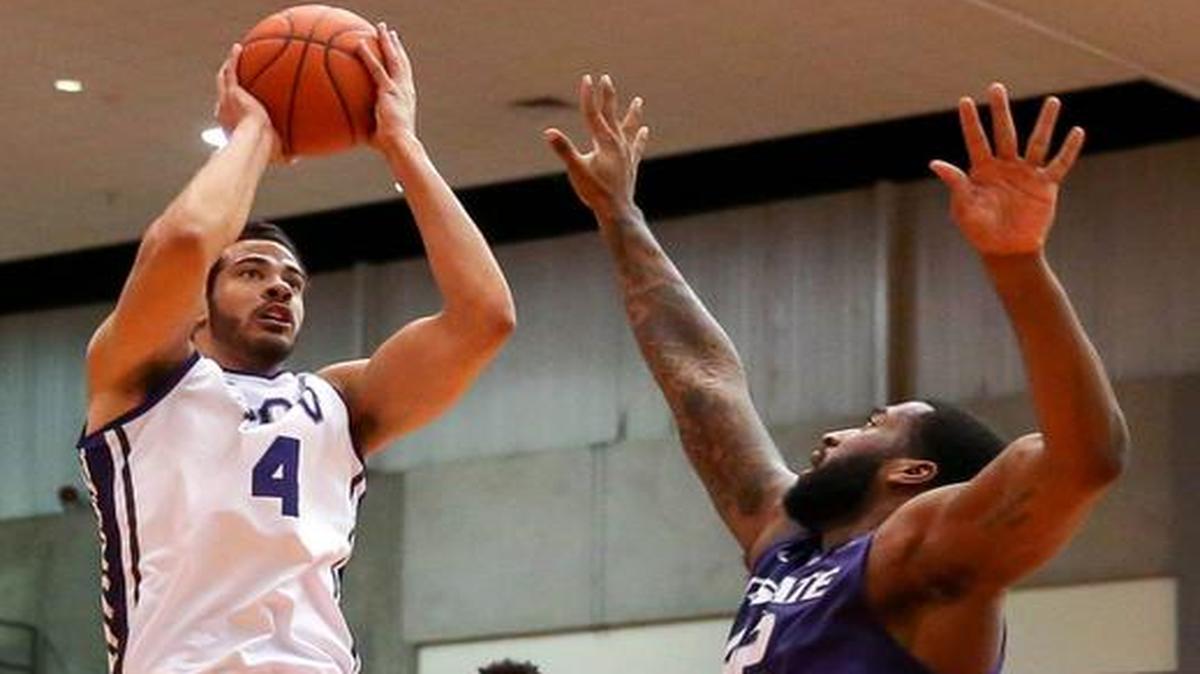 
TCU forward Amric Fields attempts a shot over Kansas State forward Thomas Gipson during the first half Wednesday in Fort Worth.
