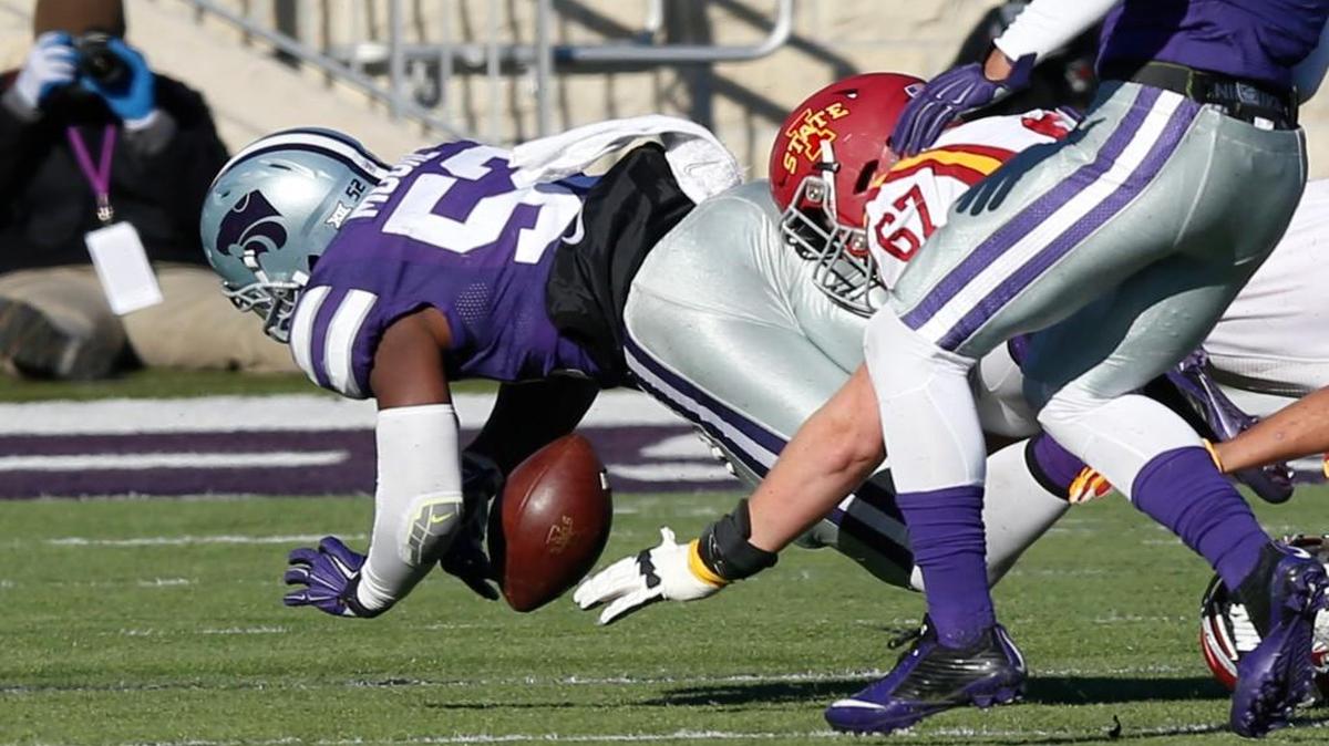 K-State linebacker Charmeachealle Moore recovers a fumble in the final seconds Saturday, setting up the game-winning field goal.