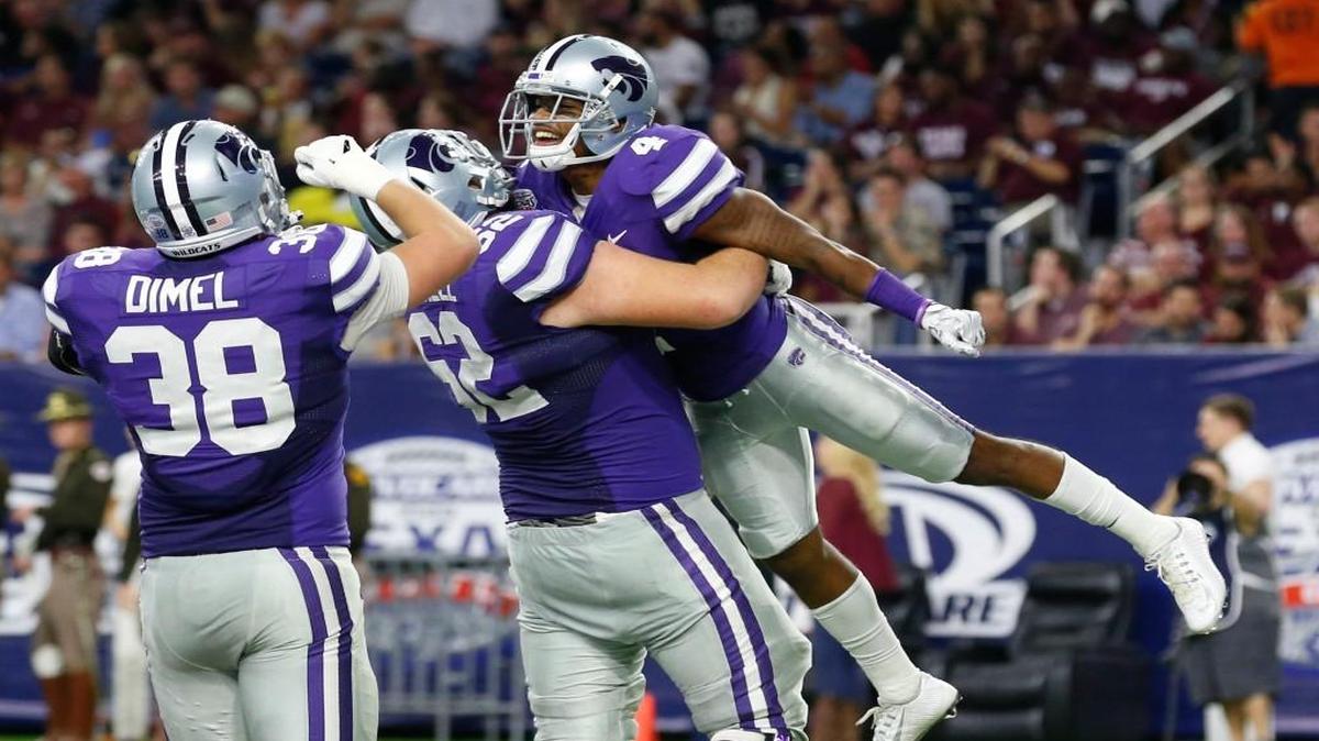 K-State wide receiver Dominique Heath (4) celebrates his second-quarter touchdown run against Texas A&M.