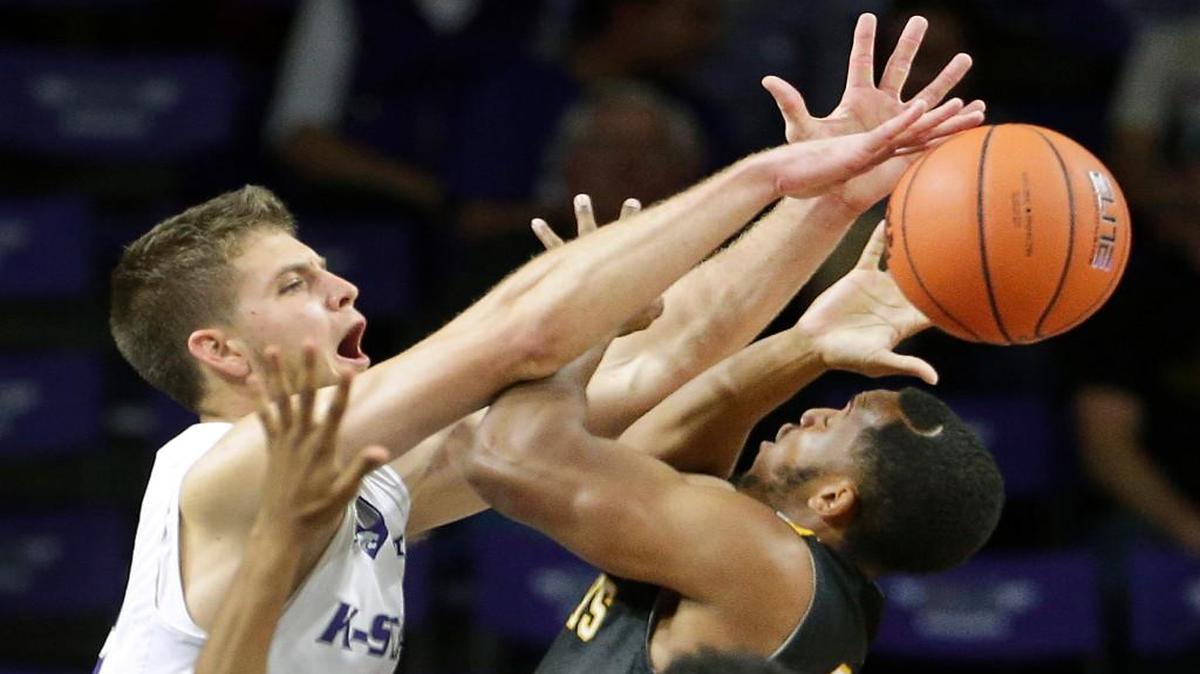 Kansas State's Brian Rohleder, left, knocks the ball away from Fort Hays State's Craig Nicholson during the first half of an exhibition college basketball game Friday, Nov. 6, 2015, in Manhattan, Kan. Kansas State won 70-52.