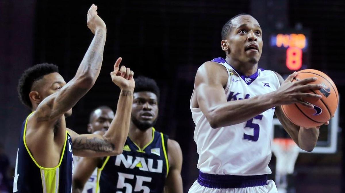 Kansas State guard Barry Brown (5) drives the lane past Northern Arizona defenders Jojo Anderson, left, and Ruben Fuamba (55) during the second half Monday night in Manhattan.