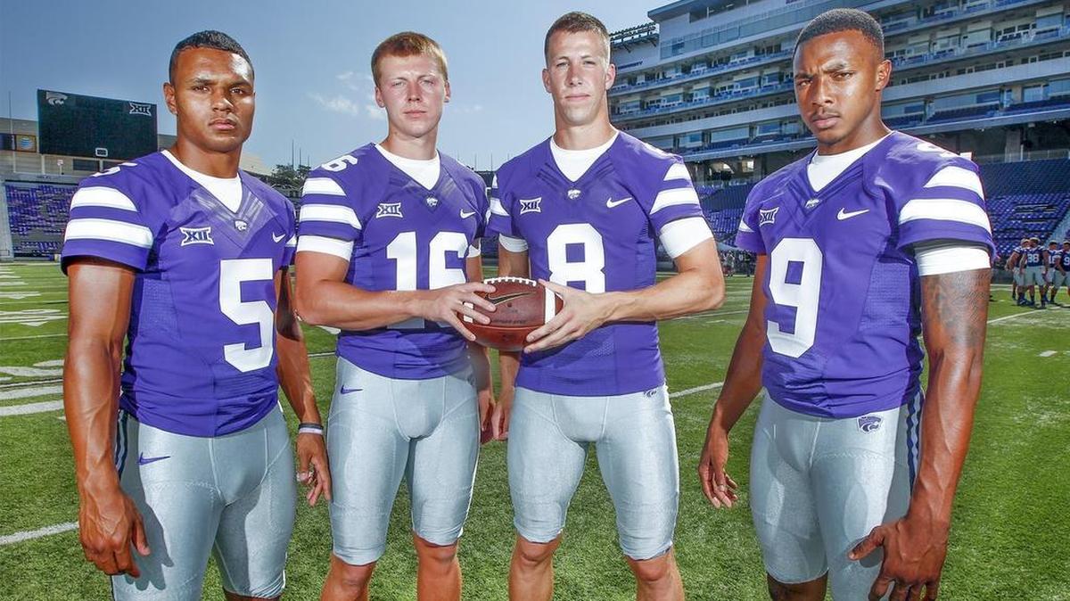 
Kansas State quarterbacks Alex Delton (5), Jesse Ertz (16), Joe Hubener (8) and Jonathan Banks (9) pose for a picture during media day at Snyder Family Stadium on Saturday.
