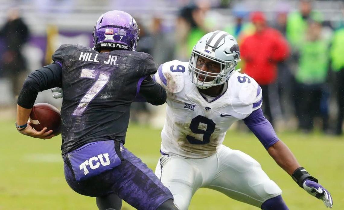 K-State linebacker Elijah Lee sizes of TCU quarterback Kenny Hill before making the tackle. (December 3, 2016)