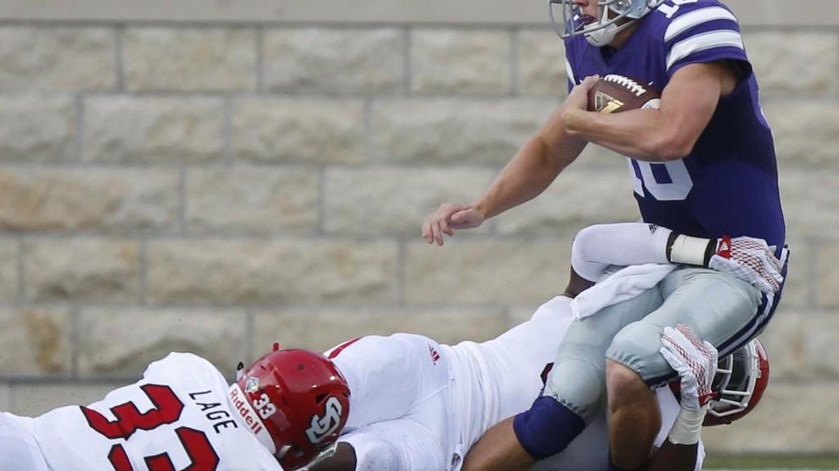 K-State quarterback Jesse Ertz is tackled after his first snap Saturday against South Dakota. Ertz injured his knee on he play and missed the rest of the season. (September 05, 2015)