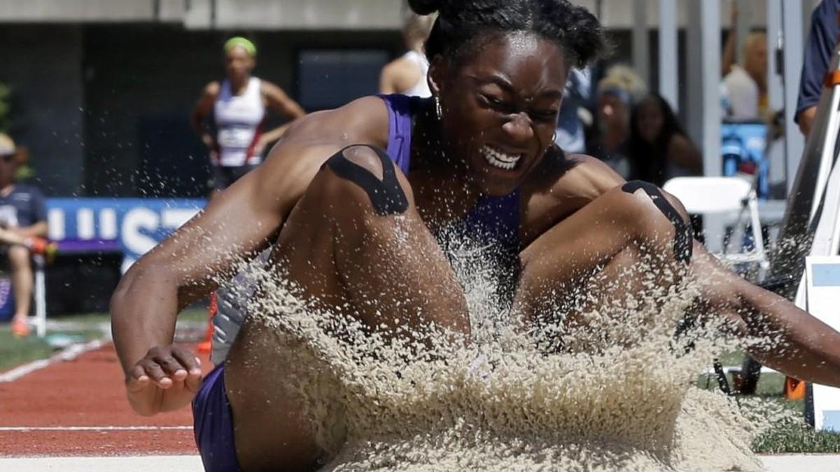 K-State's Akela Jones lands in the sand pit during the long jump event of the heptathlon at the NCAA track and field championships last year in Eugene, Ore.