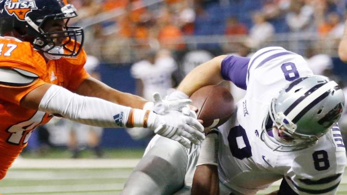 
K-State quarterback Joe Hubener (8) is brought down by UTSA Roadrunners safety Austin Robinson (3) after a long run.
