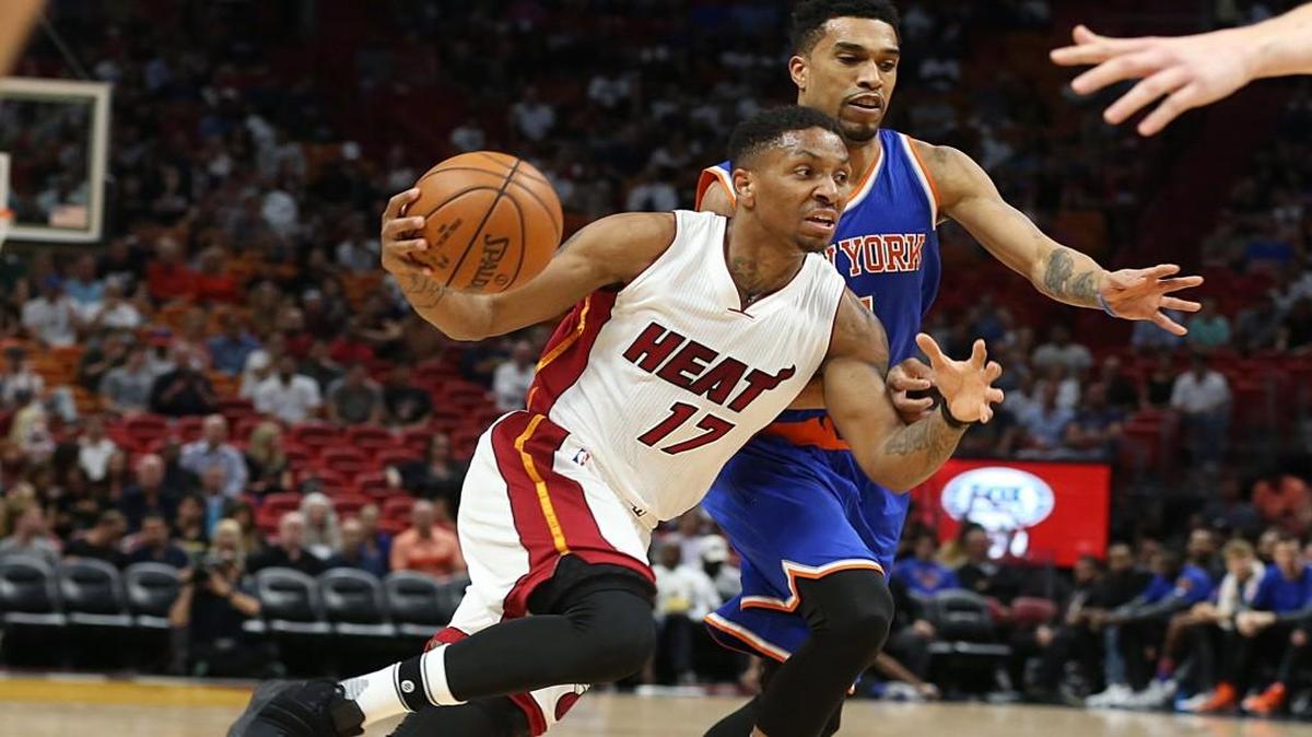 Former Kansas State guard Rodney McGruder drives to the basket against the Knicks’ Courtney Lee at AmericanAirlines Arena in Miami during a game in late March.