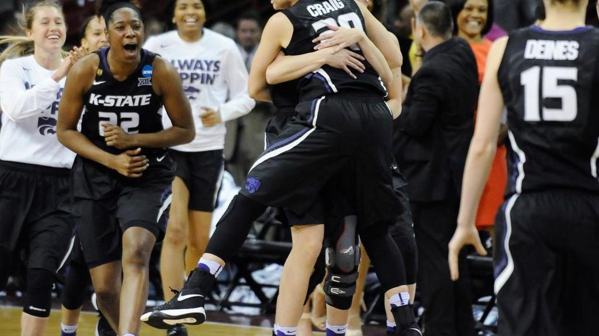 Kansas State players celebrate after defeating George Washington 56-51 during a first-round women’s NCAA Tournament game in Columbia, S.C.