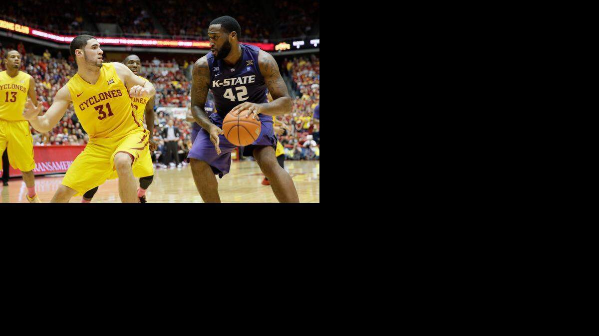 
Kansas State forward Thomas Gipson looks to drive around Iowa State forward Georges Niang during a game Jan. 20 in Ames, Iowa. Iowa State won 77-71. 
