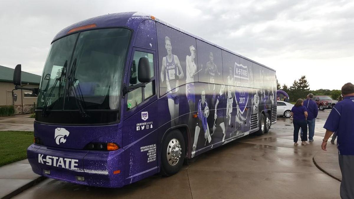 K-State fans check out the new Catbackers Tour bus before an event in Goddard on Tuesday.