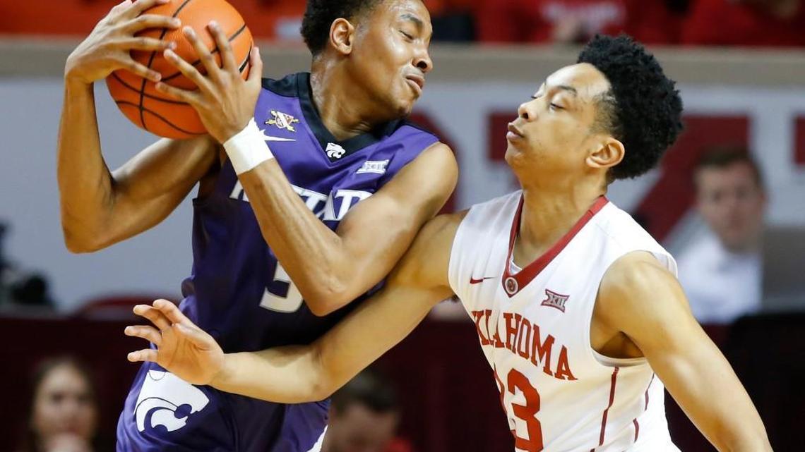 Oklahoma's Jordan Shepherd (13) defends Kansas State's Kamau Stokes on Saturday in Norman, Okla.