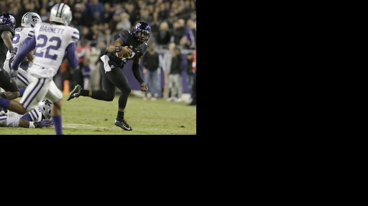 
TCU quarterback Trevone Boykin (2) runs against Kansas State defensive back Dante Barnett (22) and linebacker Elijah Lee (9) during the second quarter Saturday in Fort Worth, Texas. 
