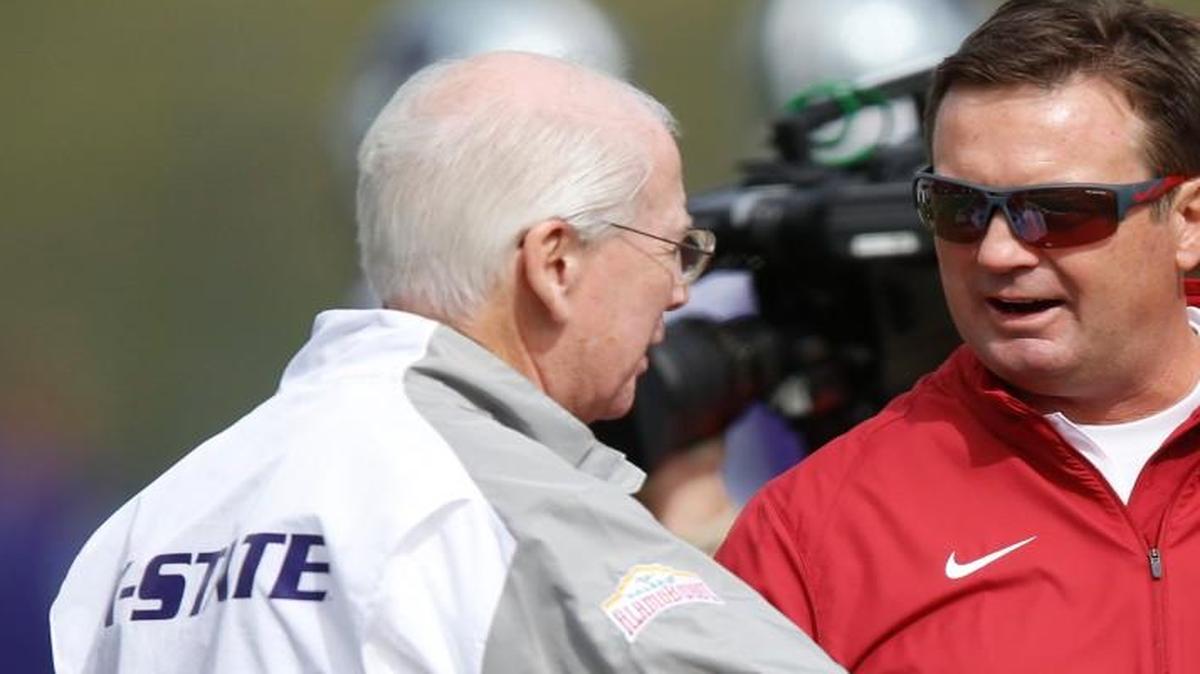 
K-State coach Bill Snyder and Oklahoma coach Bob Stoops talk before the start of Saturday's game in Manhattan.
