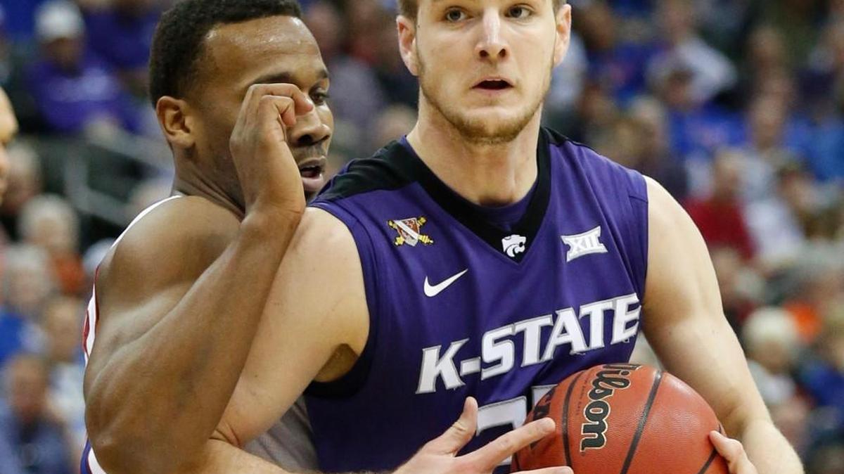 K-State forward Dean Wade tries to muscle his way past a Kansas defender. (March 10, 2016)