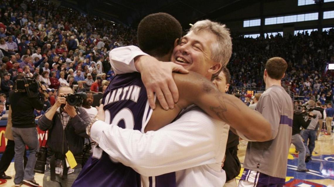 Kansas State coach Jim Wooldridge hugs Cartier Martin after the Wildcats beat Kansas on Jan. 14, 2006 at Allen Fieldhouse.