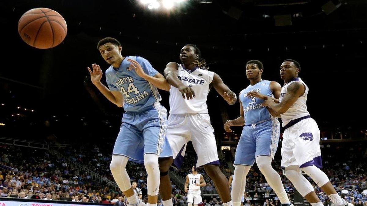North Carolina's Justin Jackson, left, and Kansas State's Carlbe Ervin watch as a ball flies out of bounds during the first half Tuesday at the Sprint Center in Kansas City, Mo.