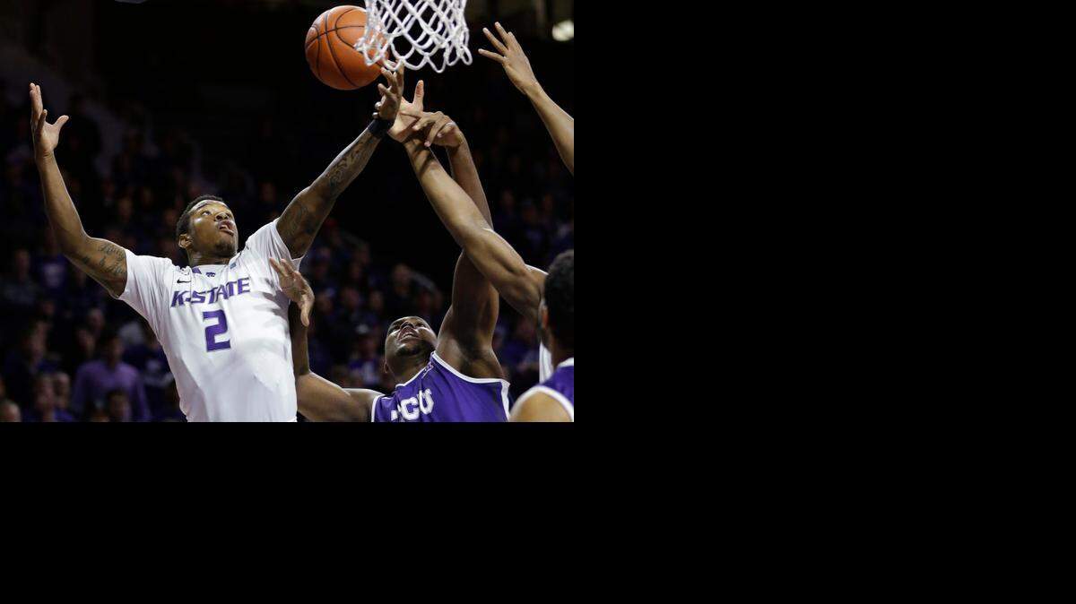 
Kansas State guard Marcus Foster rebounds against TCU forward Devonta Abron during the Wildcats’ victory Wednesday night in Manhattan.
