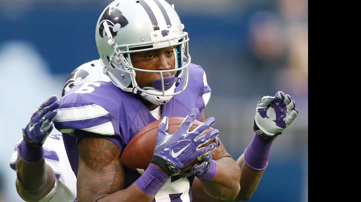 
Deante Burton snags a pass from Jesse Ertz during the K-State spring game Saturday in Kansas City, Kan.
