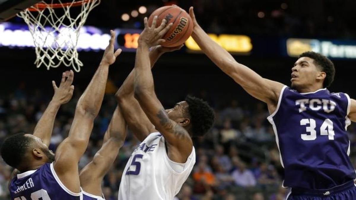 
TCU forward Kenrich Williams (34) blocks a shot by Kansas State forward Wesley Iwundu during the first half of Wednesday’s first-round game at the Big 12 Tournament at the Sprint Center in Kansas City, Mo.
