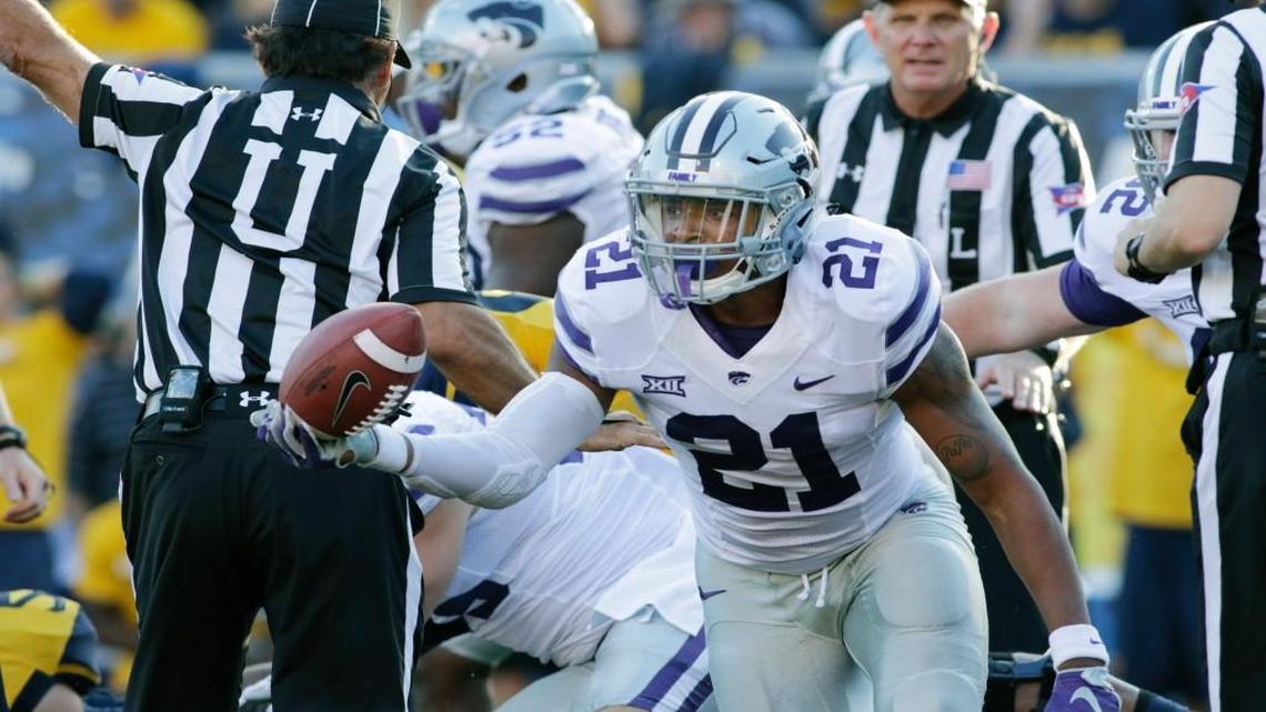 Kansas State defensive back Kendall Adams recovers a fumble during the second half.