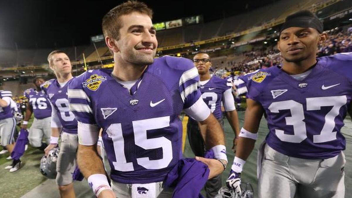
A happy quarterback Jake Waters walks off the field after K-State's win in the Buffalo Wild Wings Bowl.

