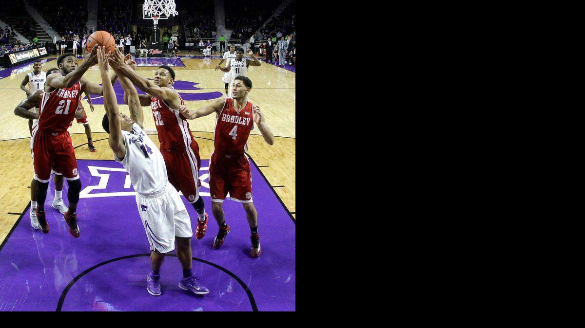 
Kansas State's Justin Edwards (14) battles between three Bradley players Tuesday in Manhattan. Edwards is one of several Wildcats being looked to for increased offense.
