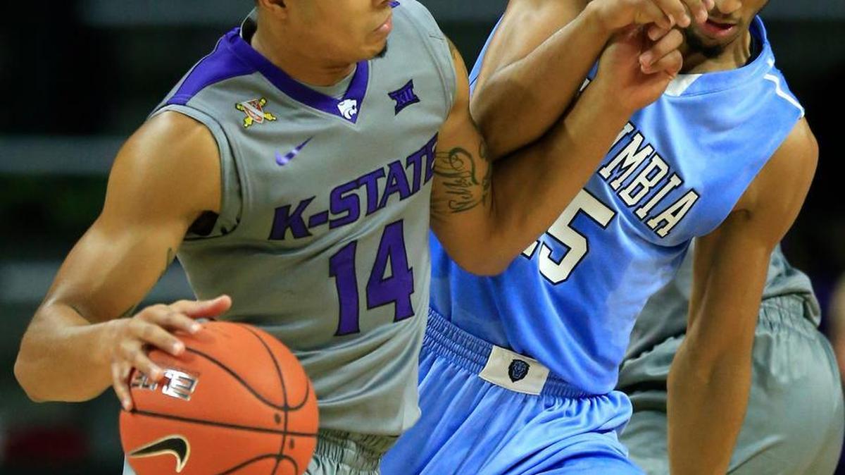 Kansas State’s Justin Edwards (14) is fouled by Columbia guard Nate Hickman (15) Monday in Manhattan.