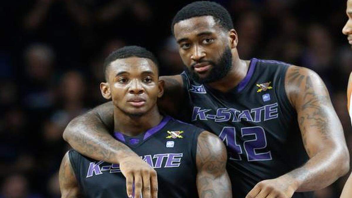 
K-State forward Thomas Gipson hugs guard Jevon Thomas after Thomas drew a foul in the closing seconds of the first half against Texas. (February 7, 2015)
