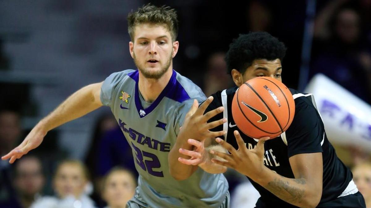 Kansas State forward Dean Wade (32) knocks the ball away from South Carolina Upstate center Isaiah Anderson, right, during the first half Wednesday night in Manhattan.