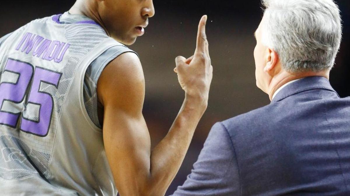 K-State guard Wesley Iwundu confers with coach Bruce Weber during a break against Kansas last season.