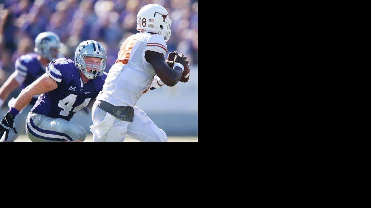 
K-State defensive end Ryan Mueller chases down Texas quarterback Tyrone Swoopes during an October game in Manhattan. 
