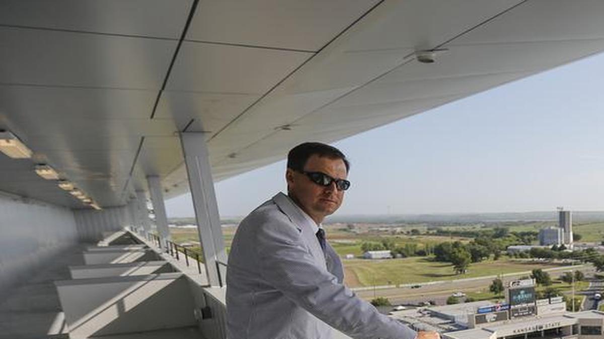 
Kansas State athletic director John Currie looks out over Snyder Family Stadium in 2013. Currie says schedule strength is important to the football team’s success. “We are a strong program and we need to continue to challenge ourselves.” 

