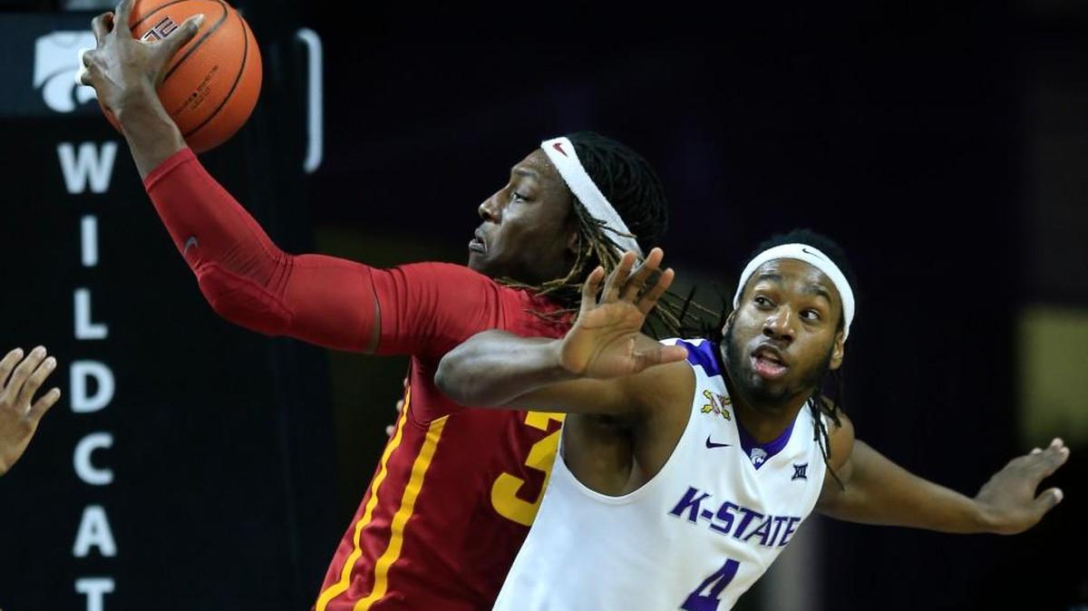 Iowa State forward Solomon Young rebounds over Kansas State forward D.J. Johnson in Manhattan, Kan., Wednesday, Feb. 15, 2017. (AP Photo/Orlin Wagner)