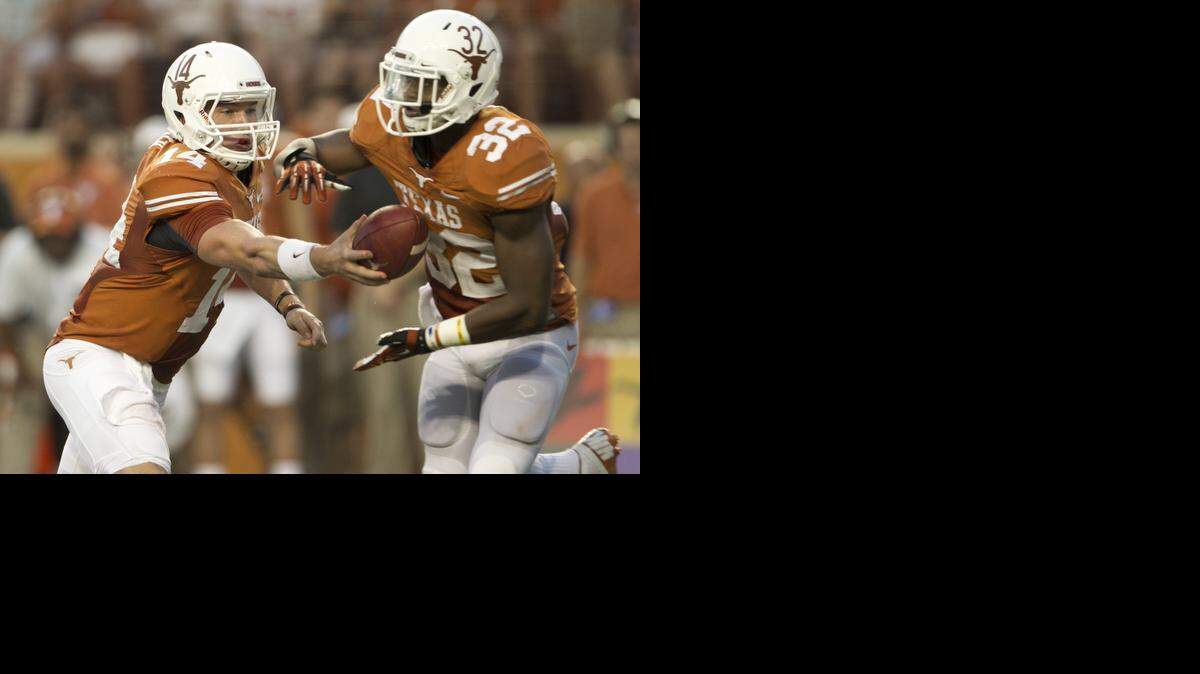 
Texas quarterback David Ash hands off to Johnathan Gray in the opening victory over New Mexico State. The Longhorns are 1-1.
