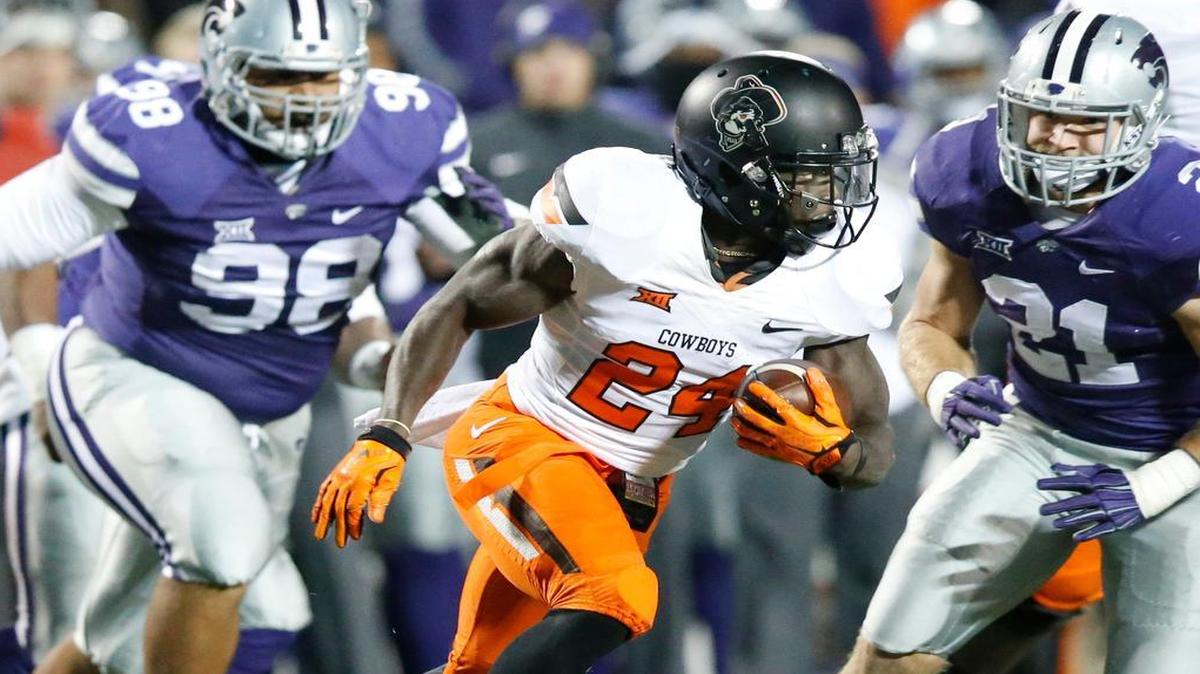 
Oklahoma State wide receiver Tyreek Hill (24) looks for a hole in the K-State defense last season in Manhattan.
