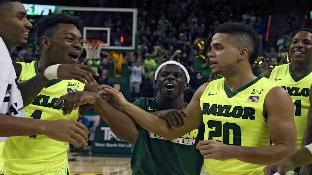 Baylor guard Manu Lecomte, right, celebrates with Wendell Mitchell, left, following their win over Iowa State, Wednesday, Jan. 4, 2017, in Waco, Texas.(AP Photo/Rod Aydelotte)