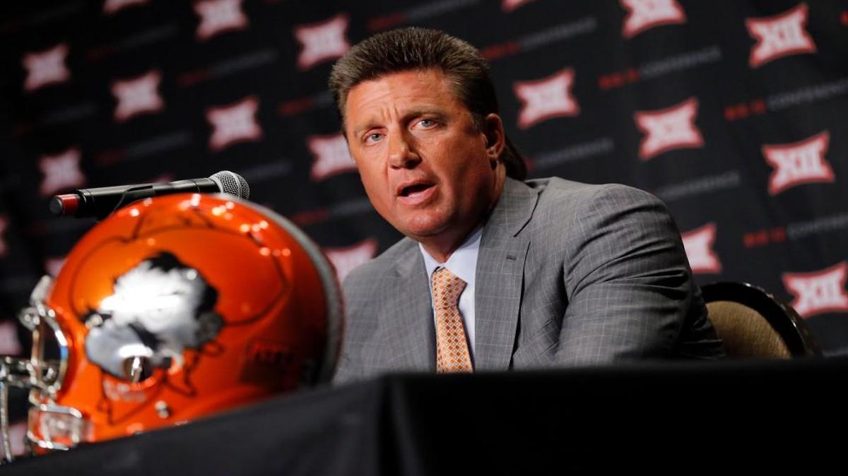 Oklahoma State head football coach Mike Gundy answers questions during Big 12 media days, Monday, July 18, 2016, in Dallas. (AP Photo/Tony Gutierrez)