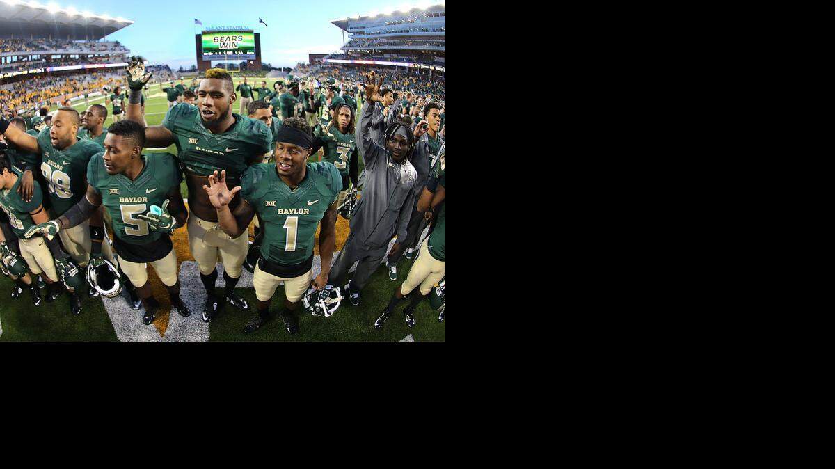 
Baylor football players celebrate a victory over Kansas. (AP Photo/ Jerry Larson)
