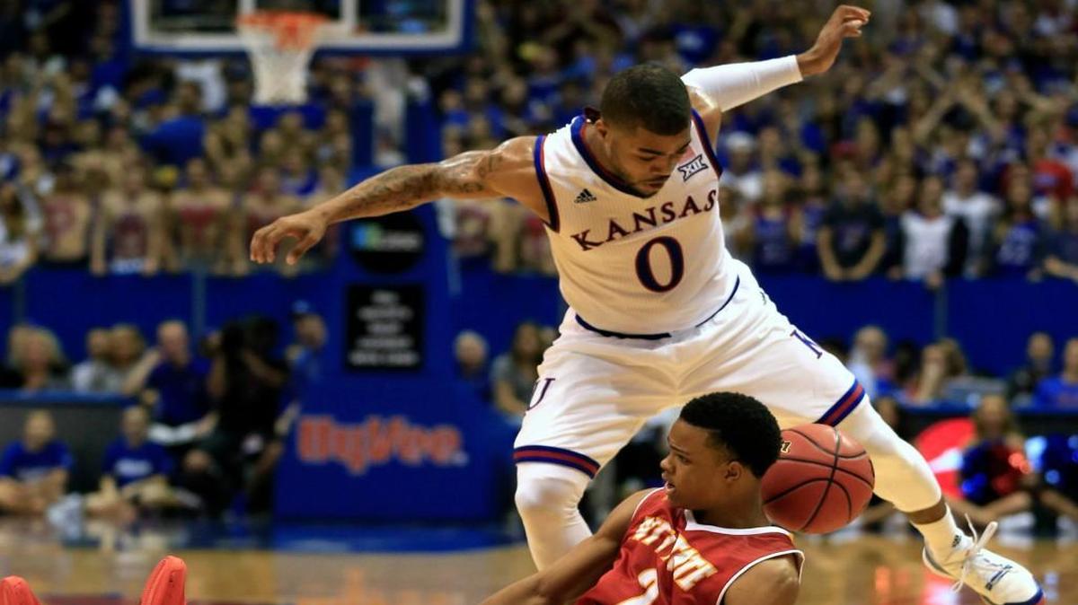 Kansas guard Frank Mason tries to steal the ball from Pittsburg State guard Louis Rollins during the first half of Wednesday’s exhibition game in Lawrence.
