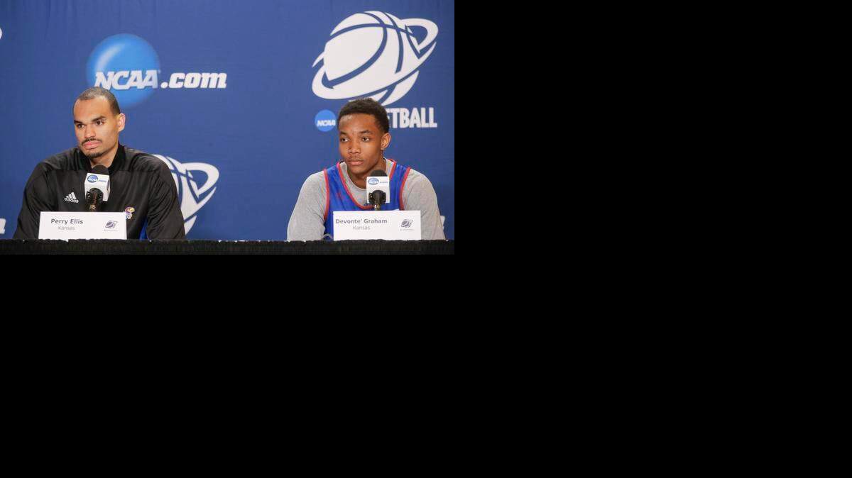 
Kansas' Perry Ellis and Devonte’ Graham answer questions at the CenturyLink Center in Omaha on Saturday. Kansas and Wichita State will face one another on Sunday with a shot at the Sweet 16 on the line.
