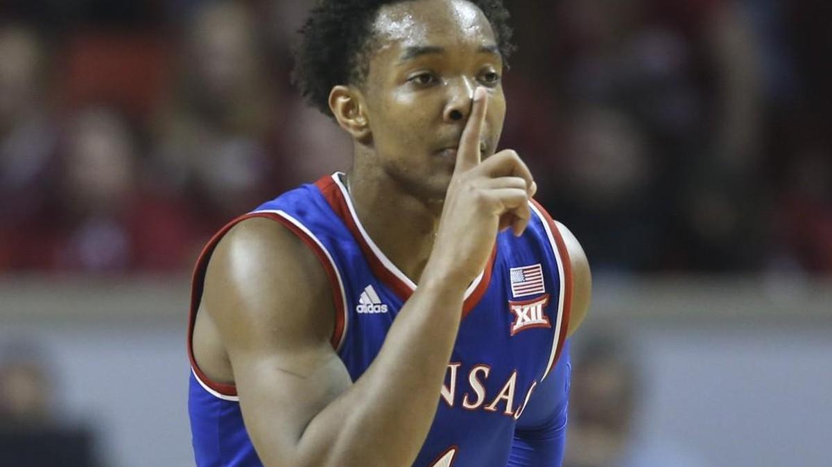 Devonte Graham quiets the Oklahoma crowd after hitting a three-pointer during the first half Saturday in Norman, Okla.