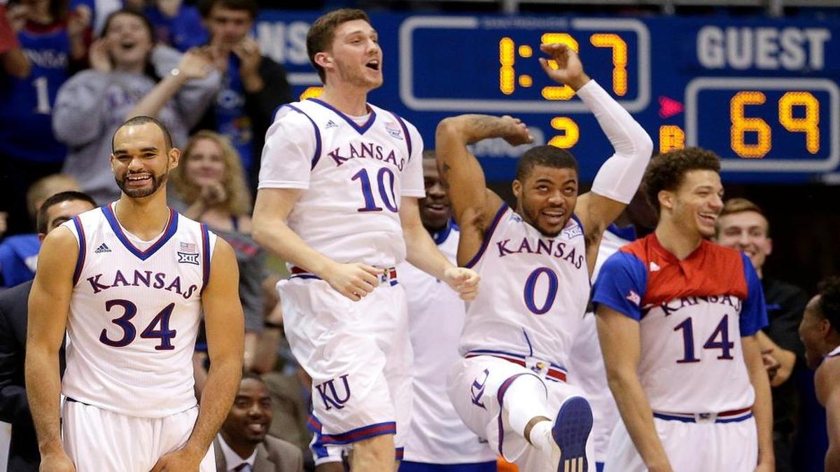 Kansas players celebrate a teammate's basket during the second half against Northern Colorado on Friday at Allen Fieldhouse.