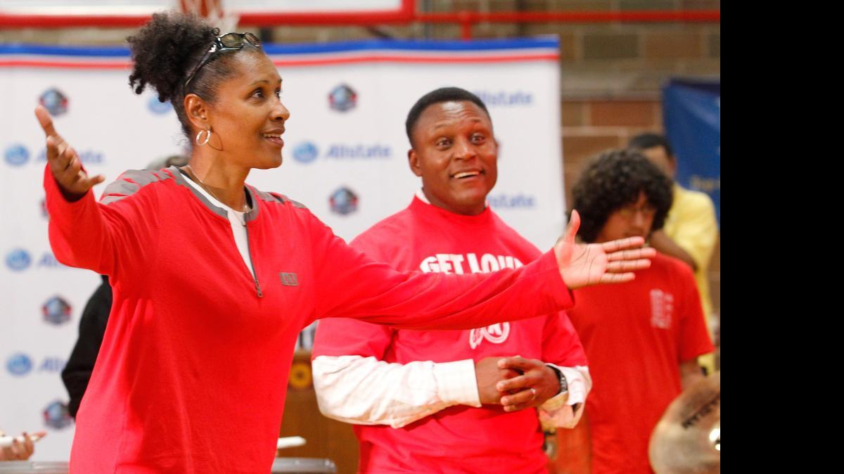 
Hometown heroes Lynette Woodard, left, and Barry Sanders enjoy themselves during a North High pep rally in 2011.
