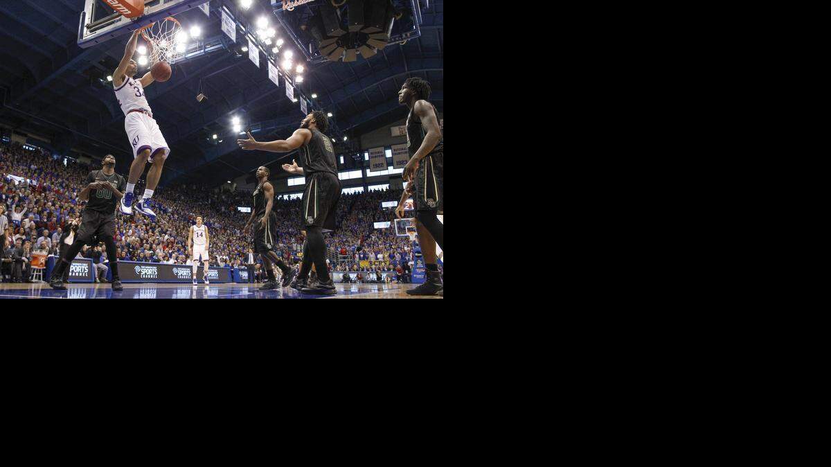 
Kansas forward Perry Ellis dunks the ball against Baylor during the first half Saturday afternoon at Allen Fieldhouse.

