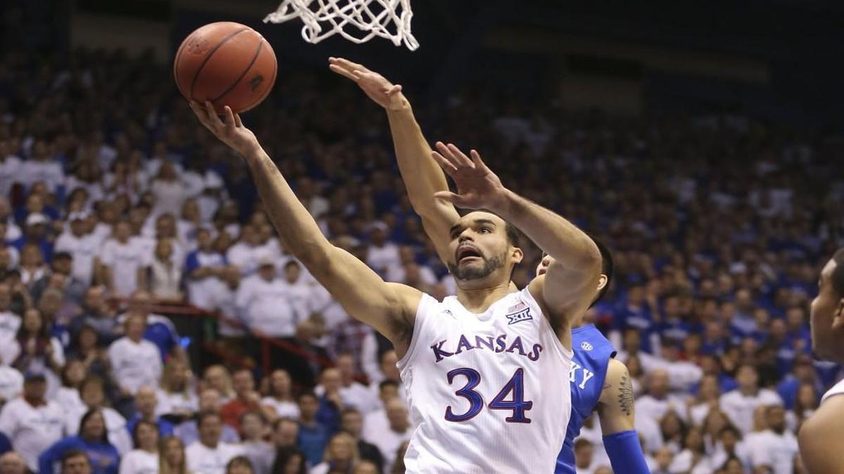 Kansas forward Perry Ellis goes to the basket against Kentucky forward Derek Willis during the first half Saturday at Allen Fieldhouse.
